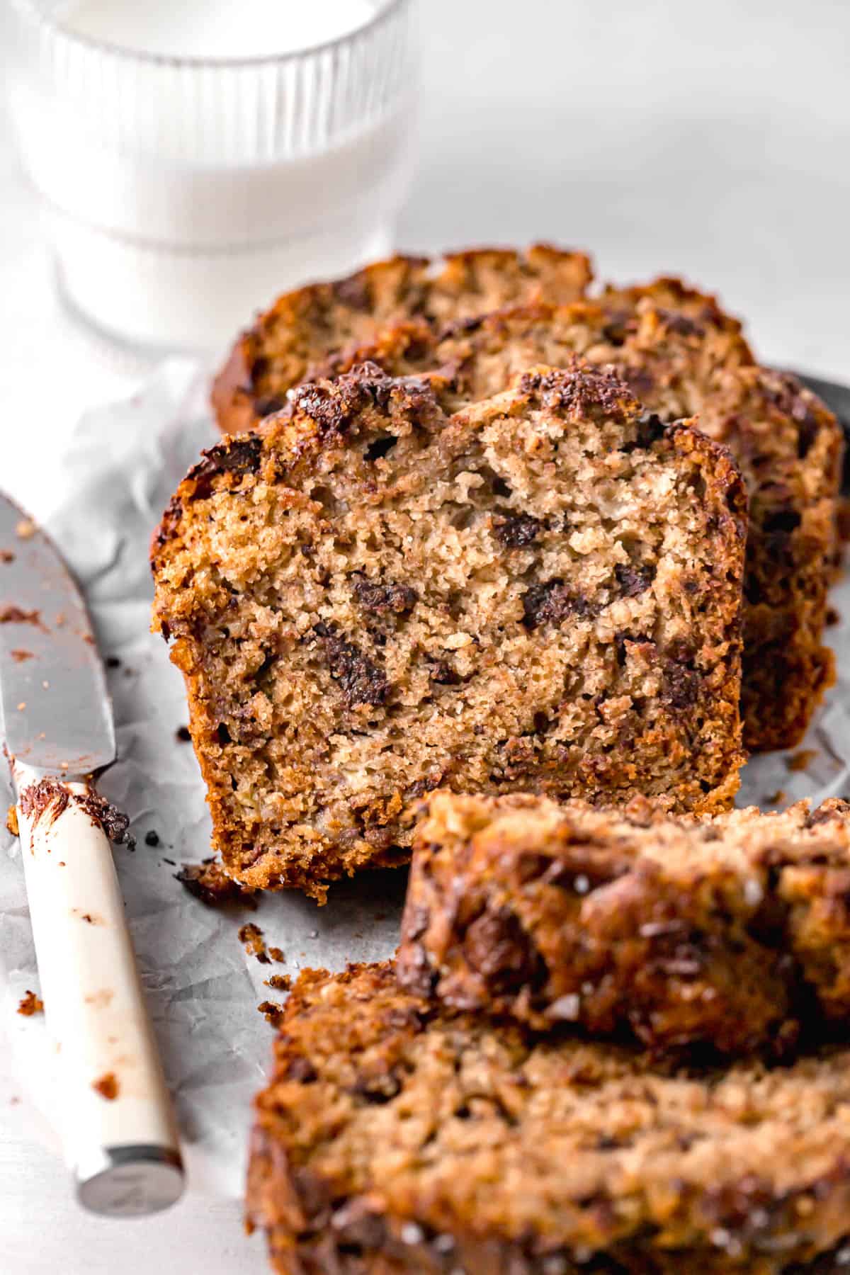 honey banana bread with chocolate chips sliced to show inside texture.