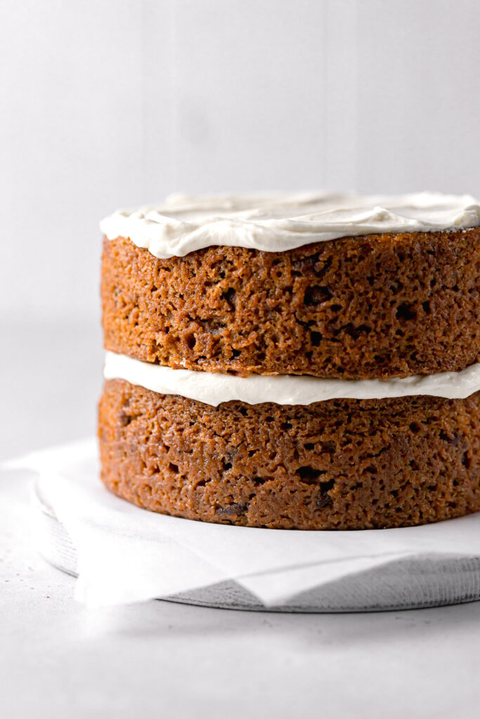 two carrot cake layers with cream cheese frosting 
