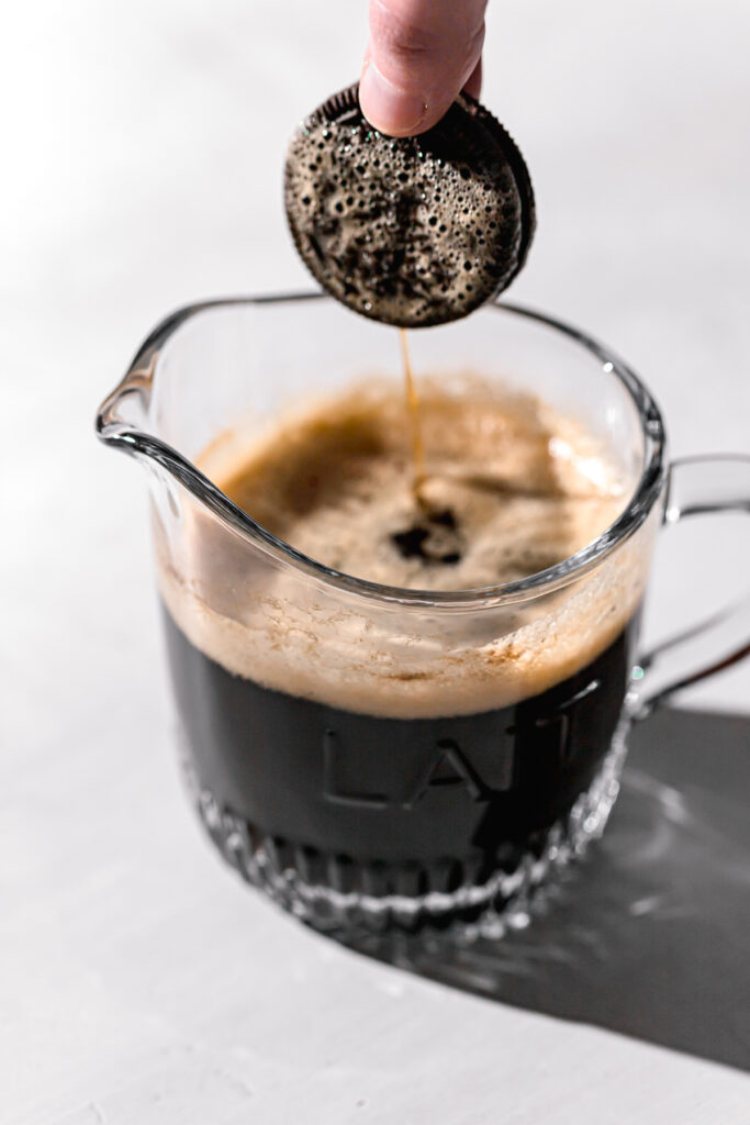 oreo being dipped in coffee
