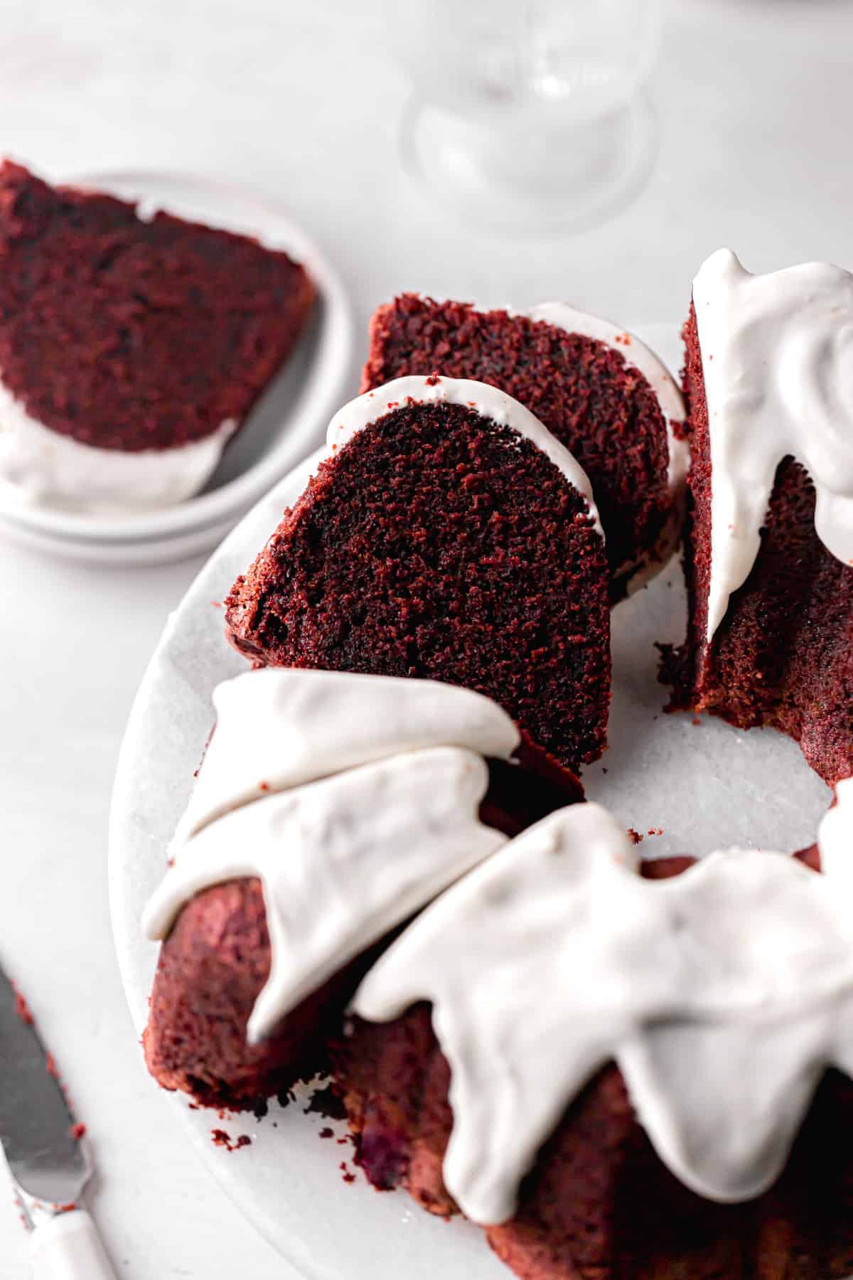 four slices cut form red velvet bundt cake and leaned up against each other.