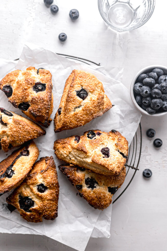 starbucks blueberry scones on parchment lined round wire rack