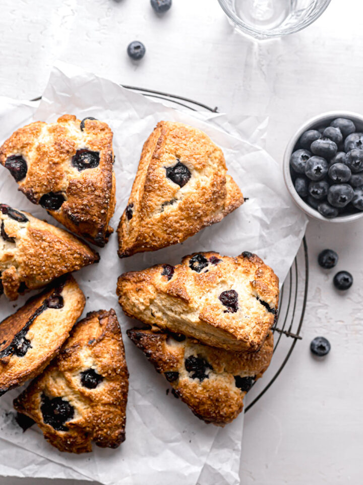 starbucks blueberry scones on parchment lined round wire rack