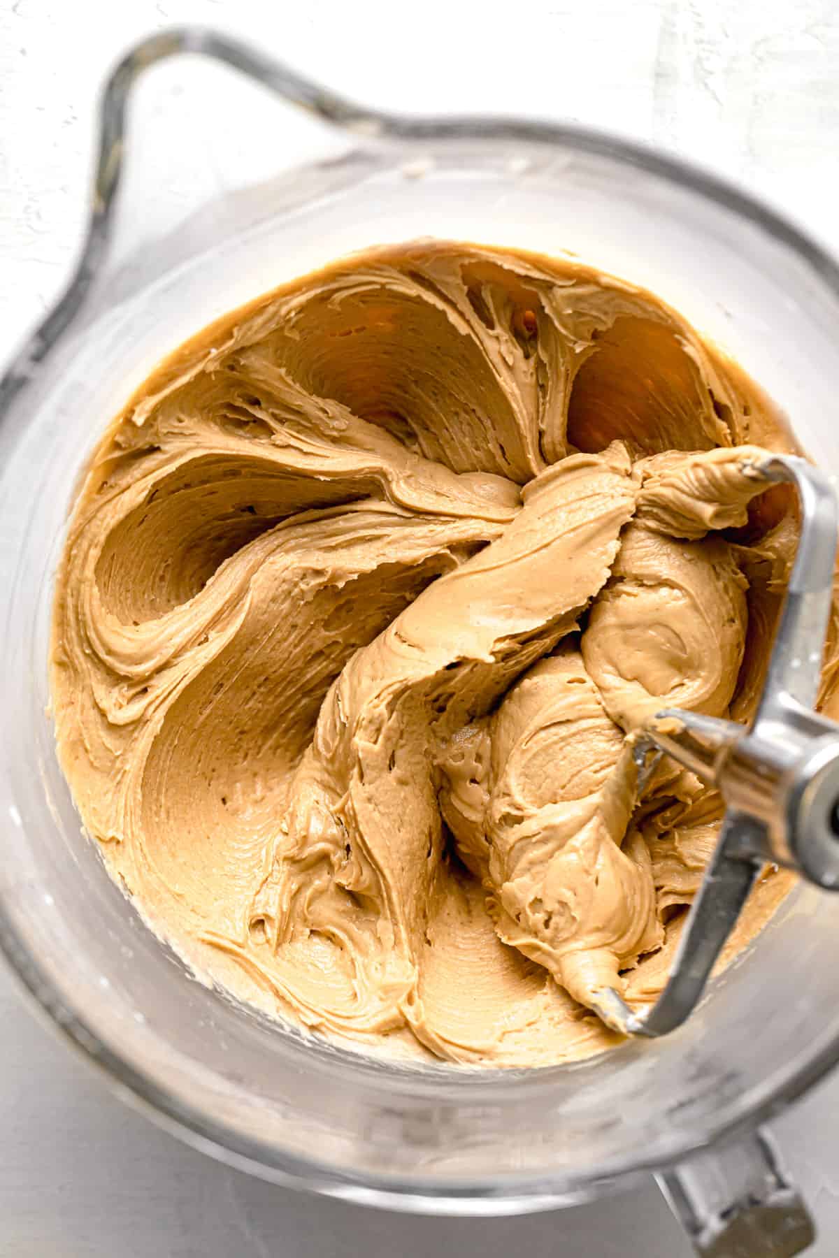 peanut butter frosting in glass bowl.