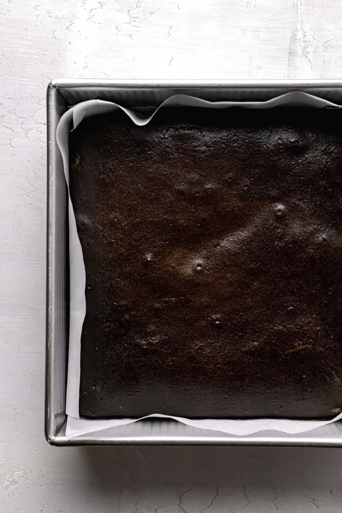 chocolate snack cake baked in square pan.