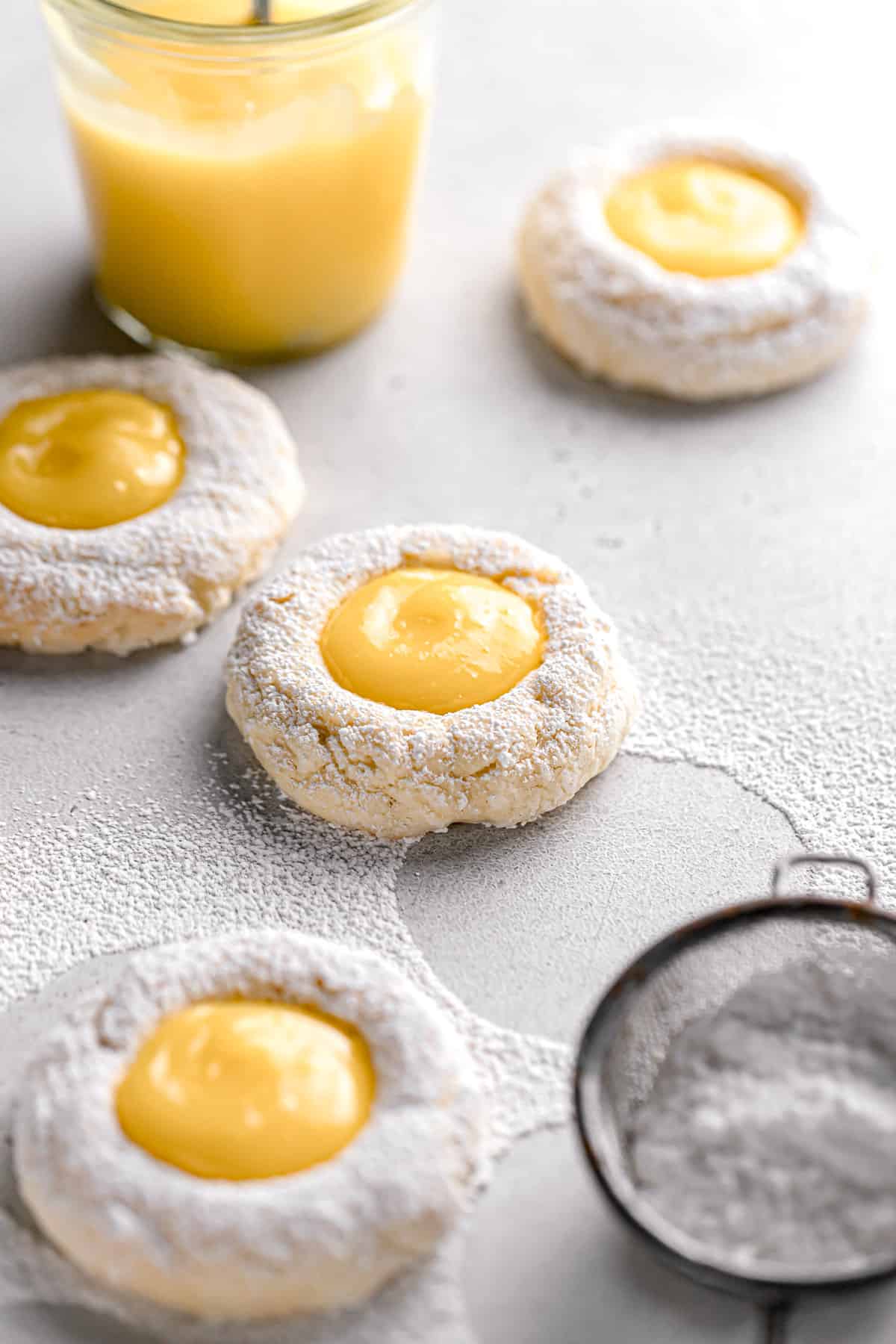 cream cheese cookies dusted with powdered sugar and filled with tart lemon curd.