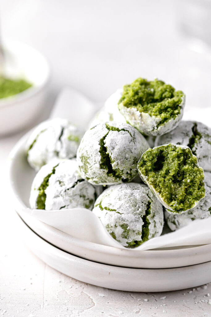 matcha cookies piled on white plate