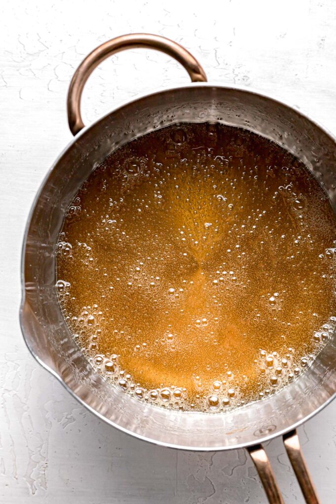 sugar and light corn syrup caramelized in saucepan