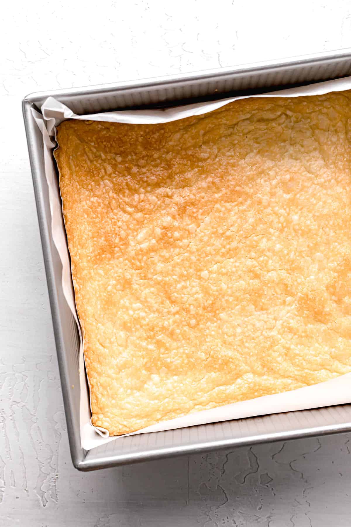 baked shortbread crust in square pan.