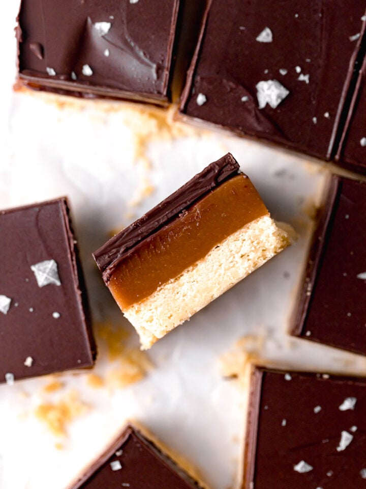 tahini caramel millionaire's shortbread on its side to show layers