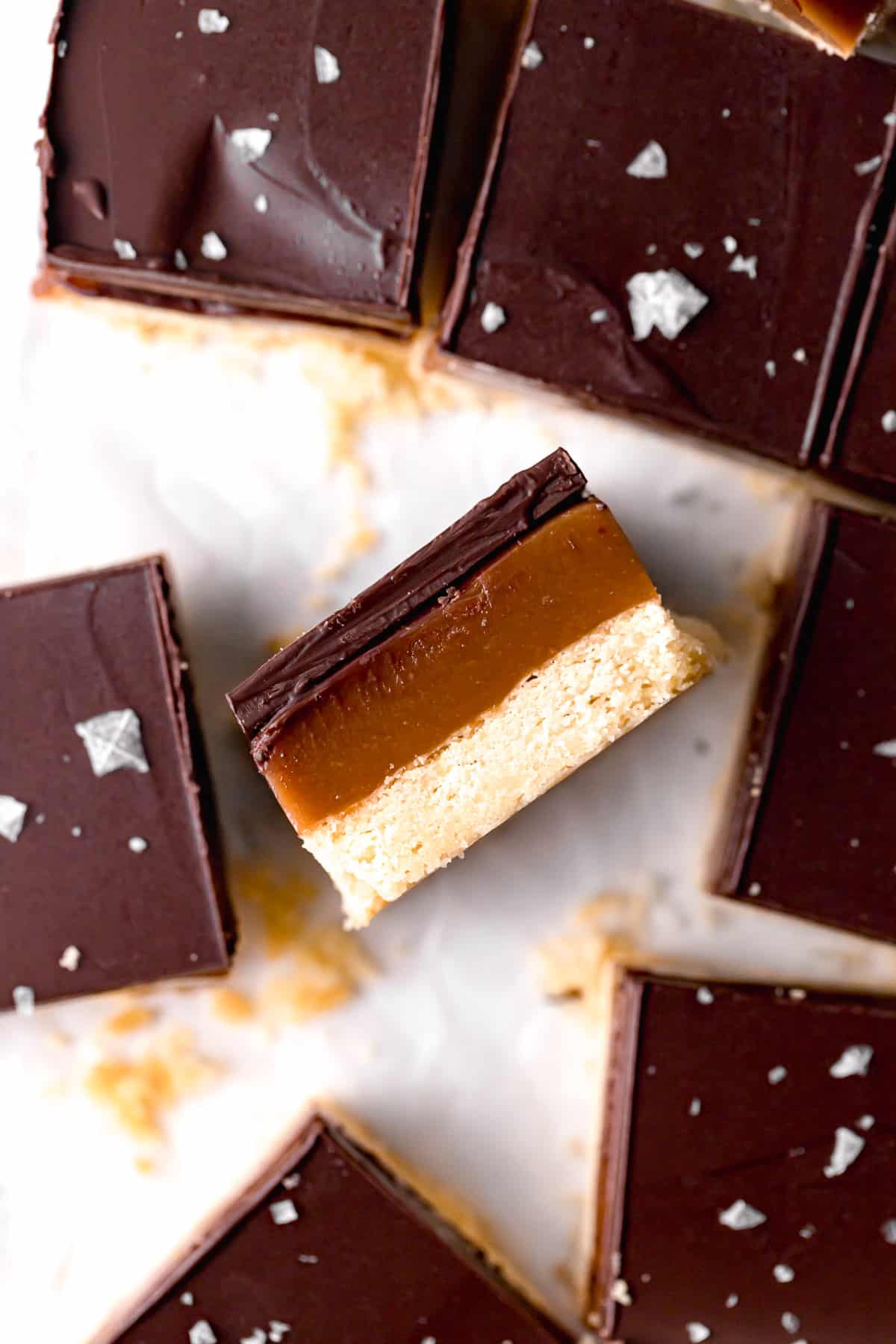 tahini caramel millionaire's shortbread on its side to show layers.