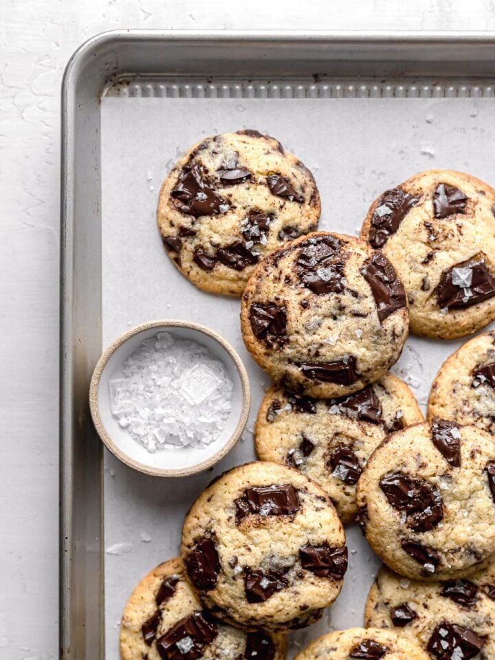 chocolate chip cookies without brown sugar piled on baking sheet
