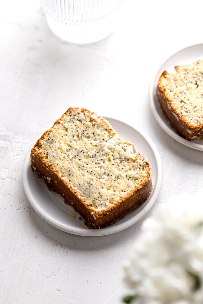 slice of lemon poppy seed loaf on small white plate
