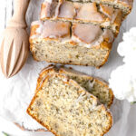 lemon poppy seed loaf cut into slices with two stacked facing upwards