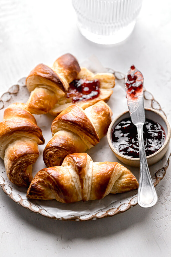 small batch mini croissants on plate with jam