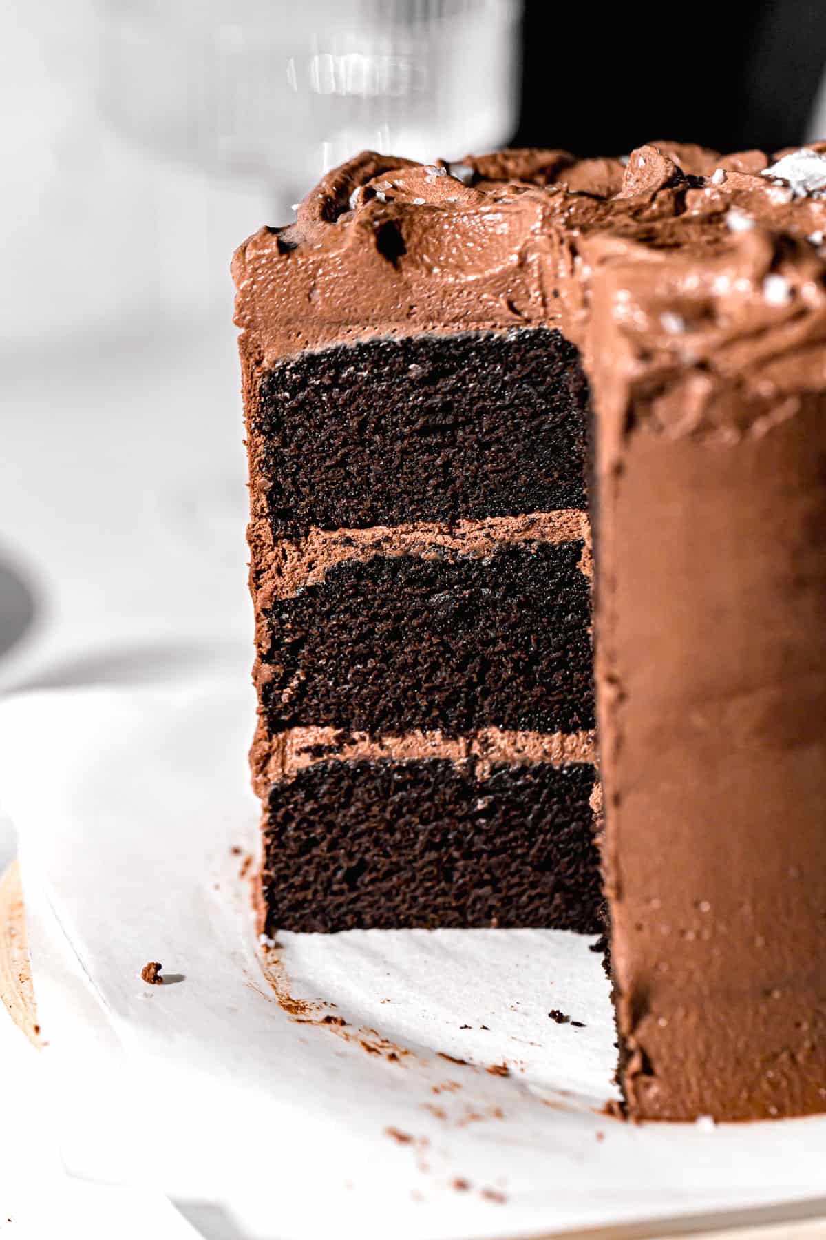 close up of dairy free chocolate cake cut to show inside texture.