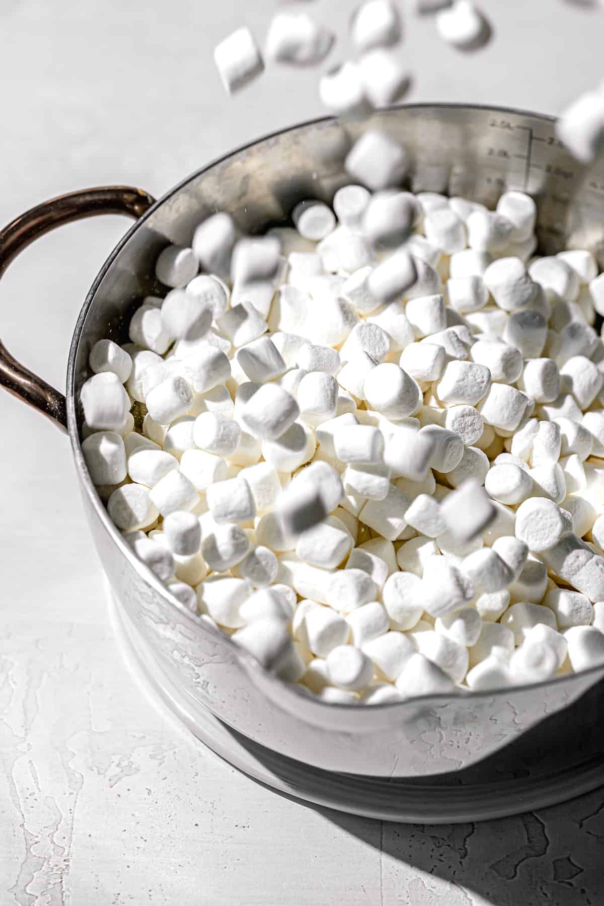 marshmallows being poured into pan