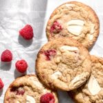 raspberry white chocolate cookies on parchment paper