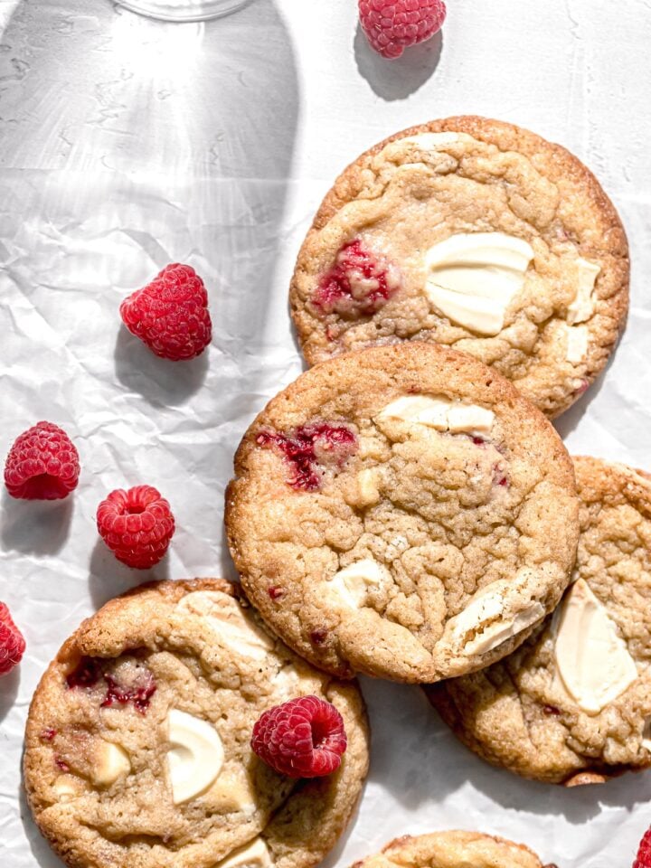 raspberry white chocolate cookies on parchment paper