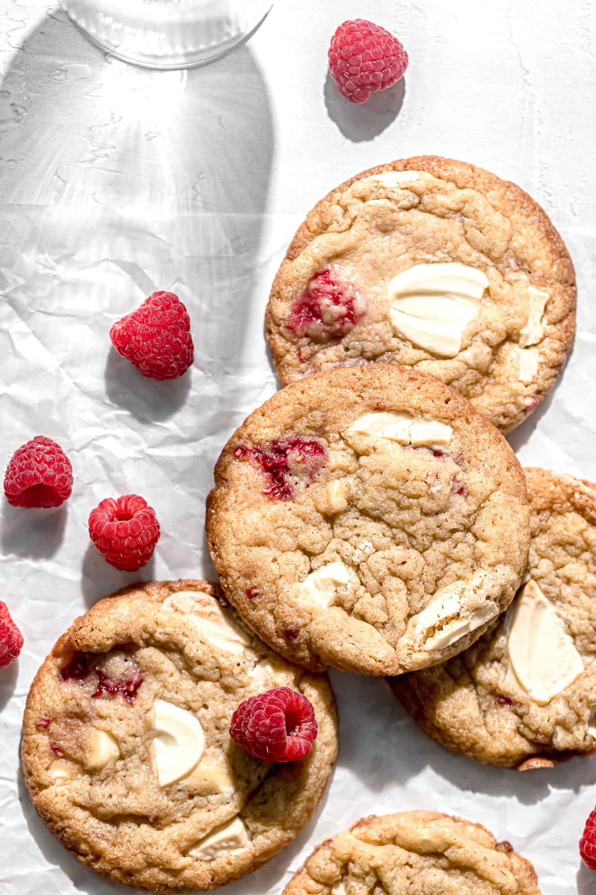raspberry white chocolate cookies on parchment paper.