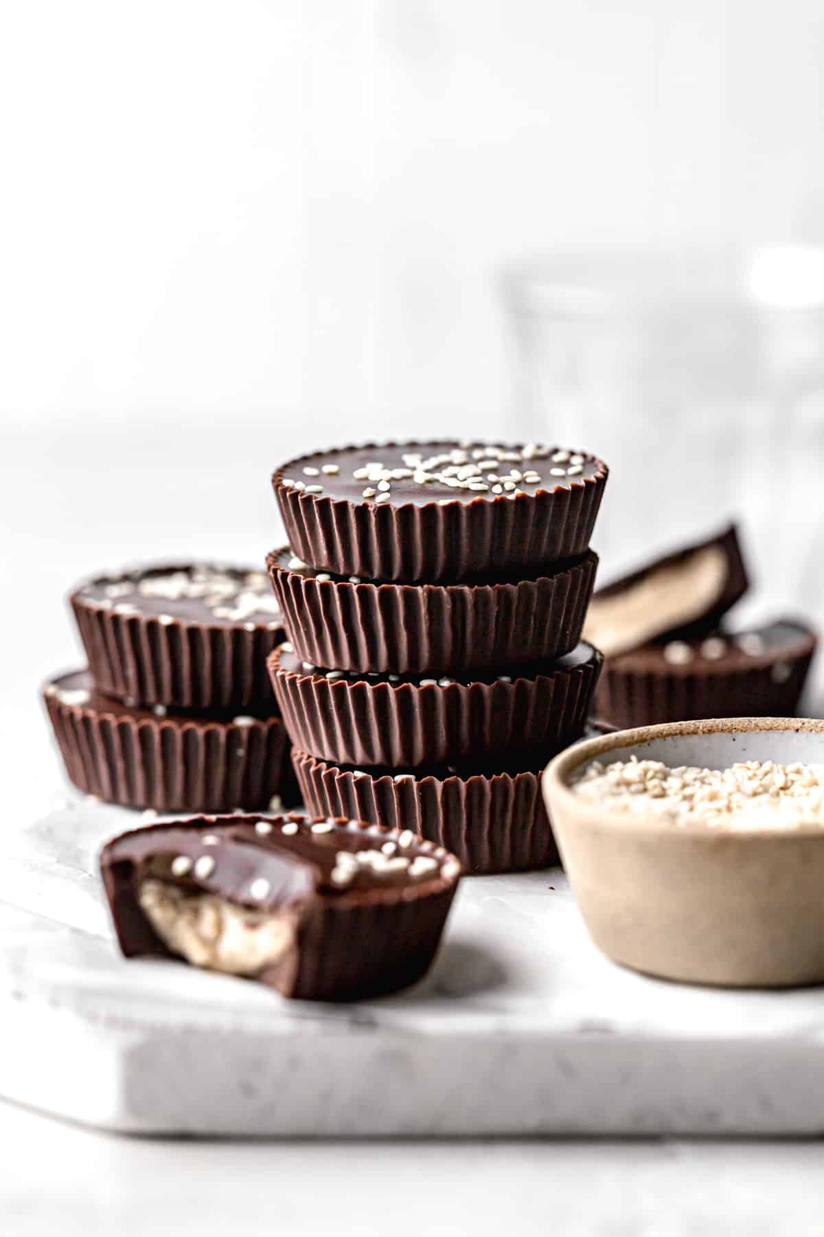 dark chocolate tahini cups stacked.