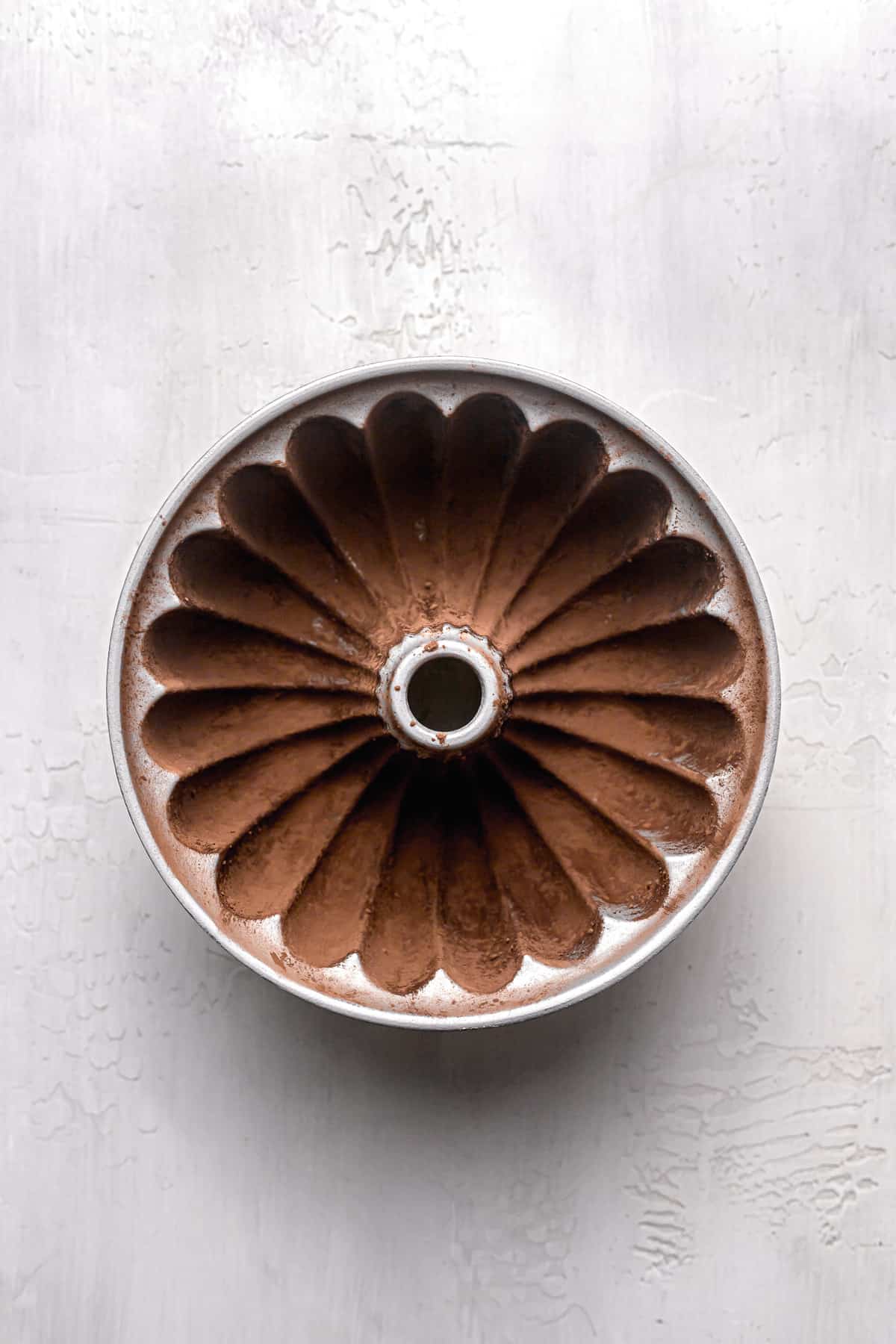 bundt pan coated with cocoa powder