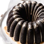 chocolate espresso bundt cake on parchment lined wooden board