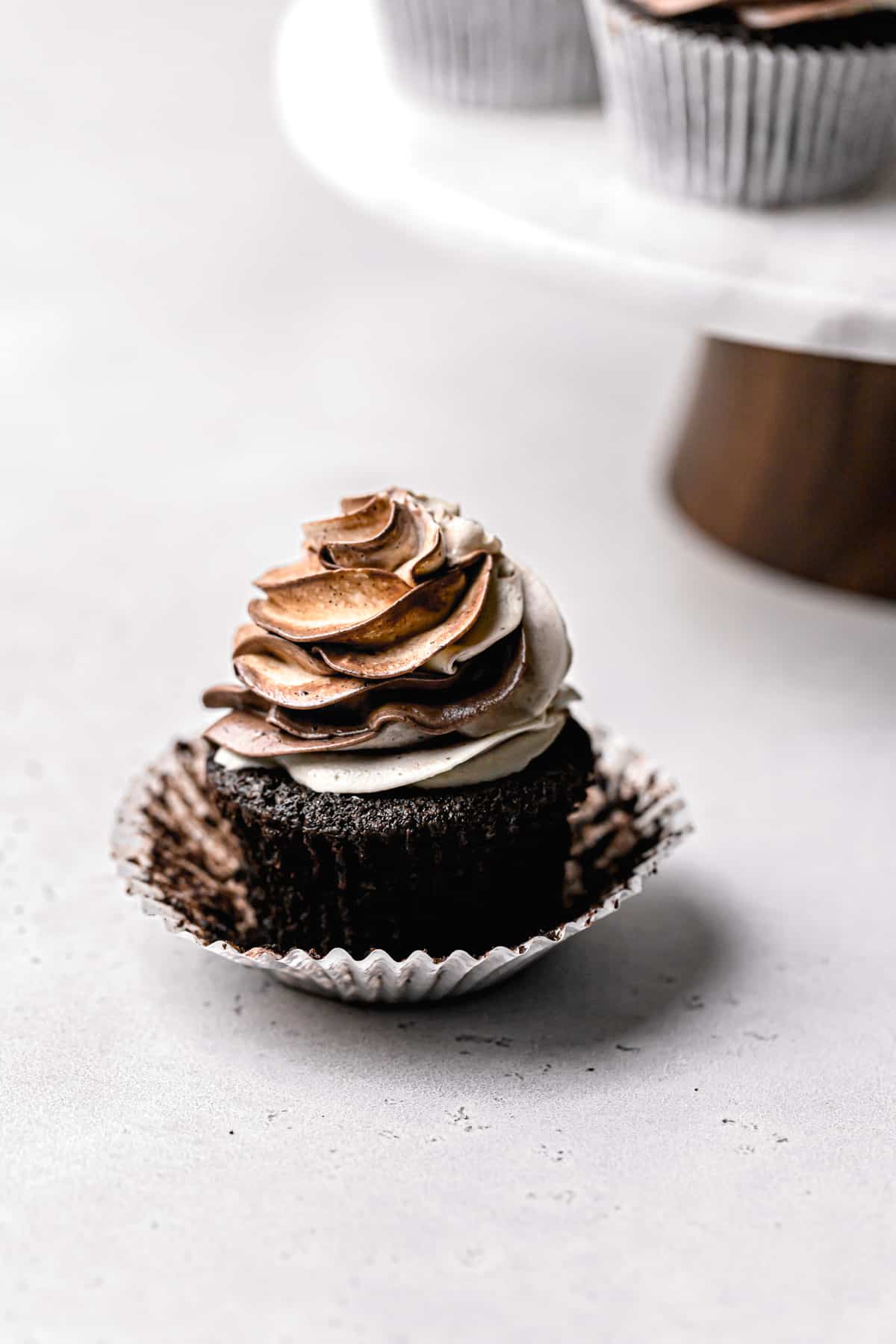 gluten free chocolate cupcake with liner pulled away from sides