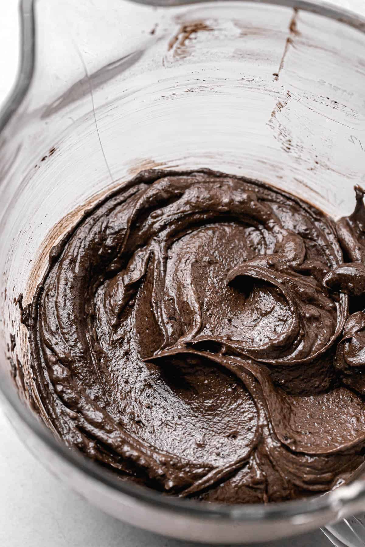 black cocoa cake batter in glass mixing bowl