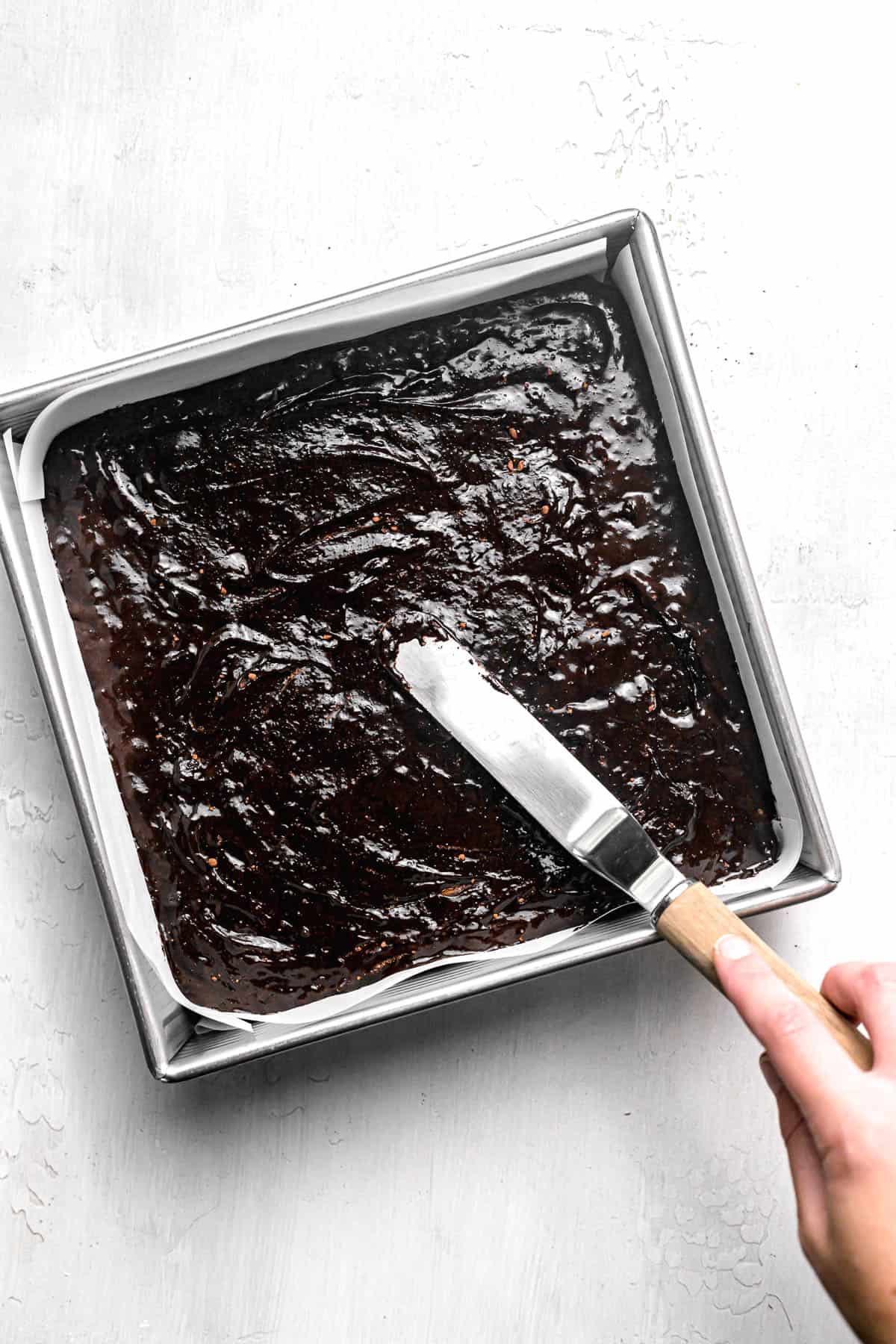 brownie batter in square pan