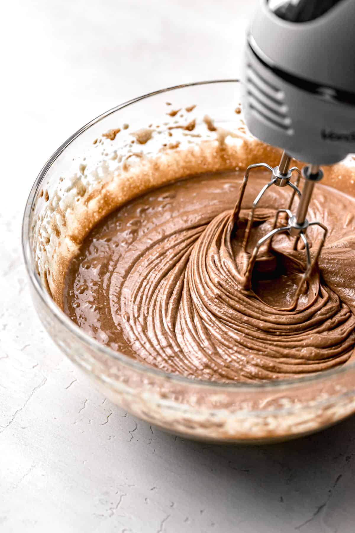 melted chocolate being mixed into batter