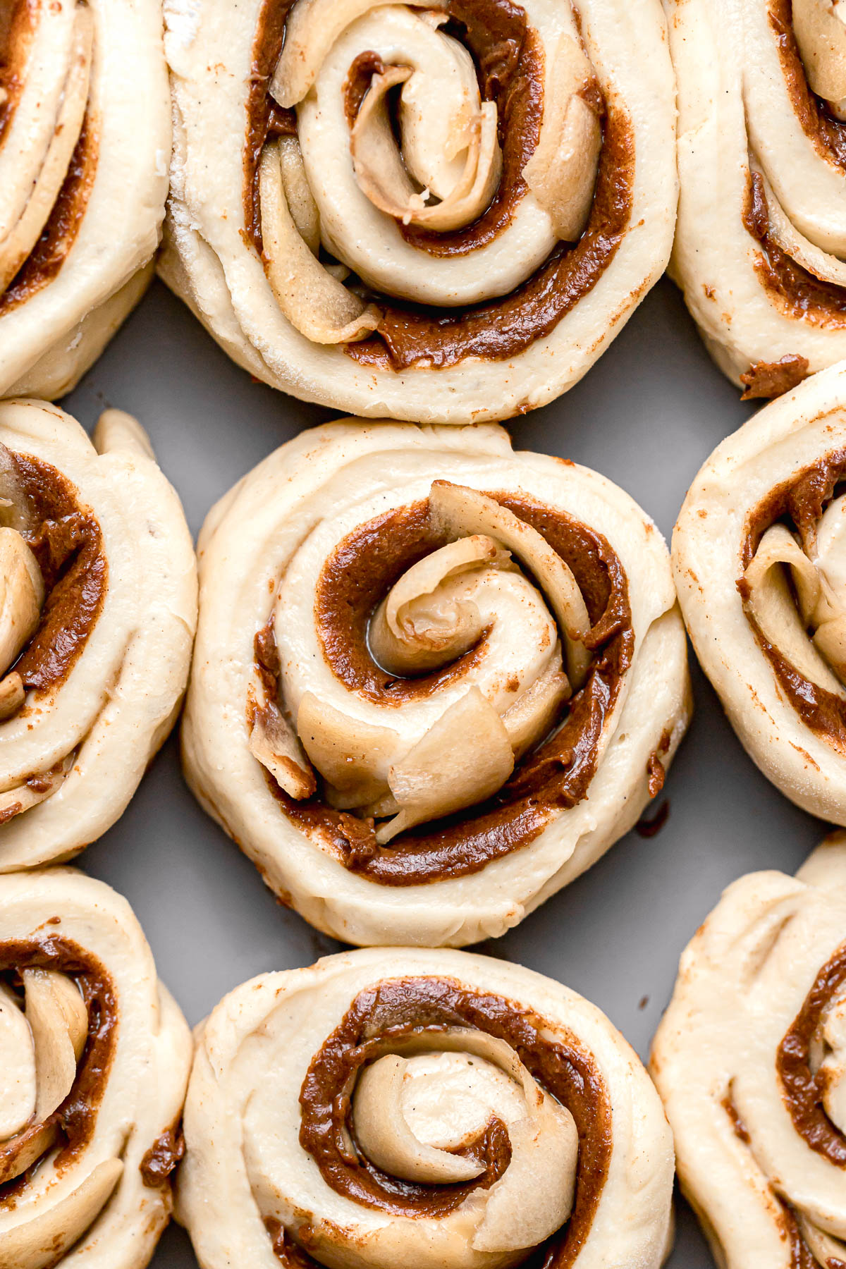 proofed cinnamon rolls with apple pie filling.