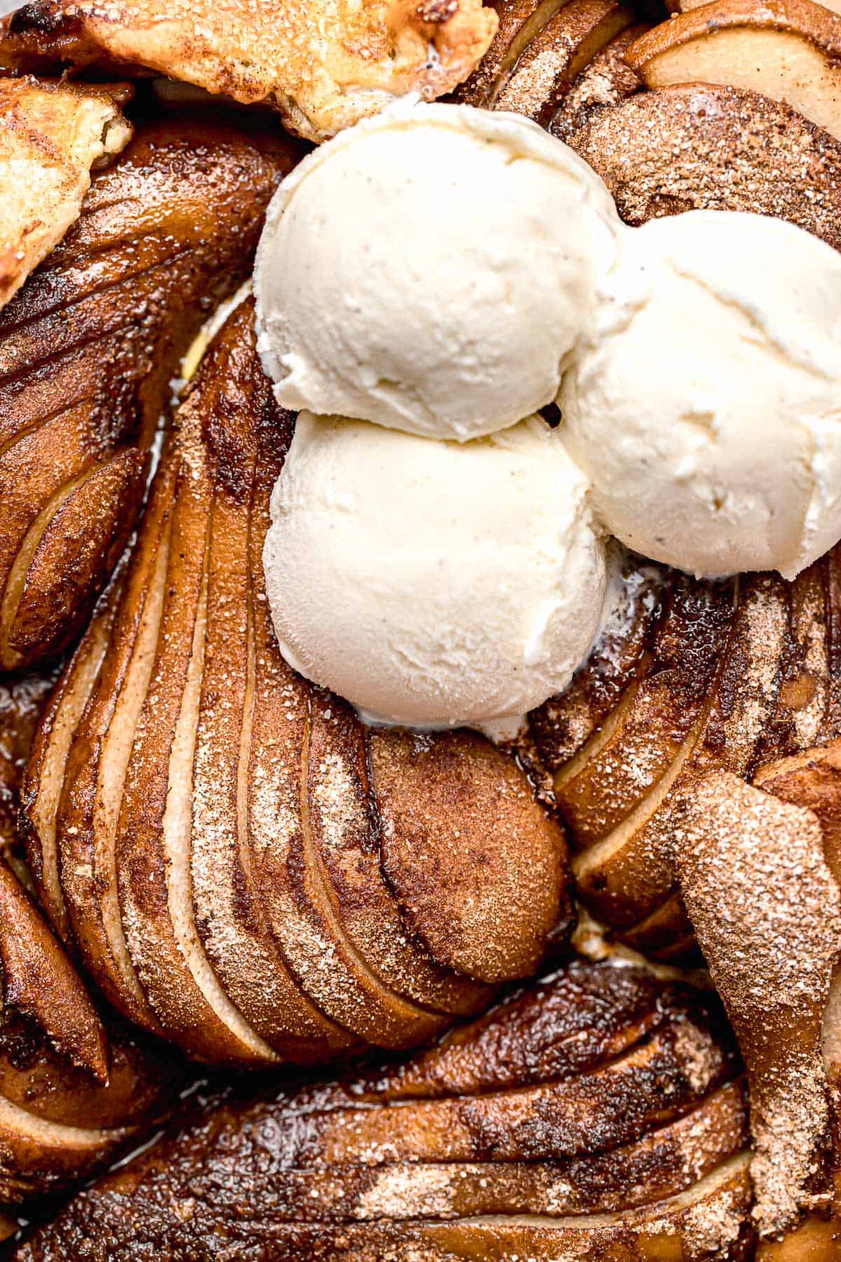 close-up of pear galette topped with ice cream