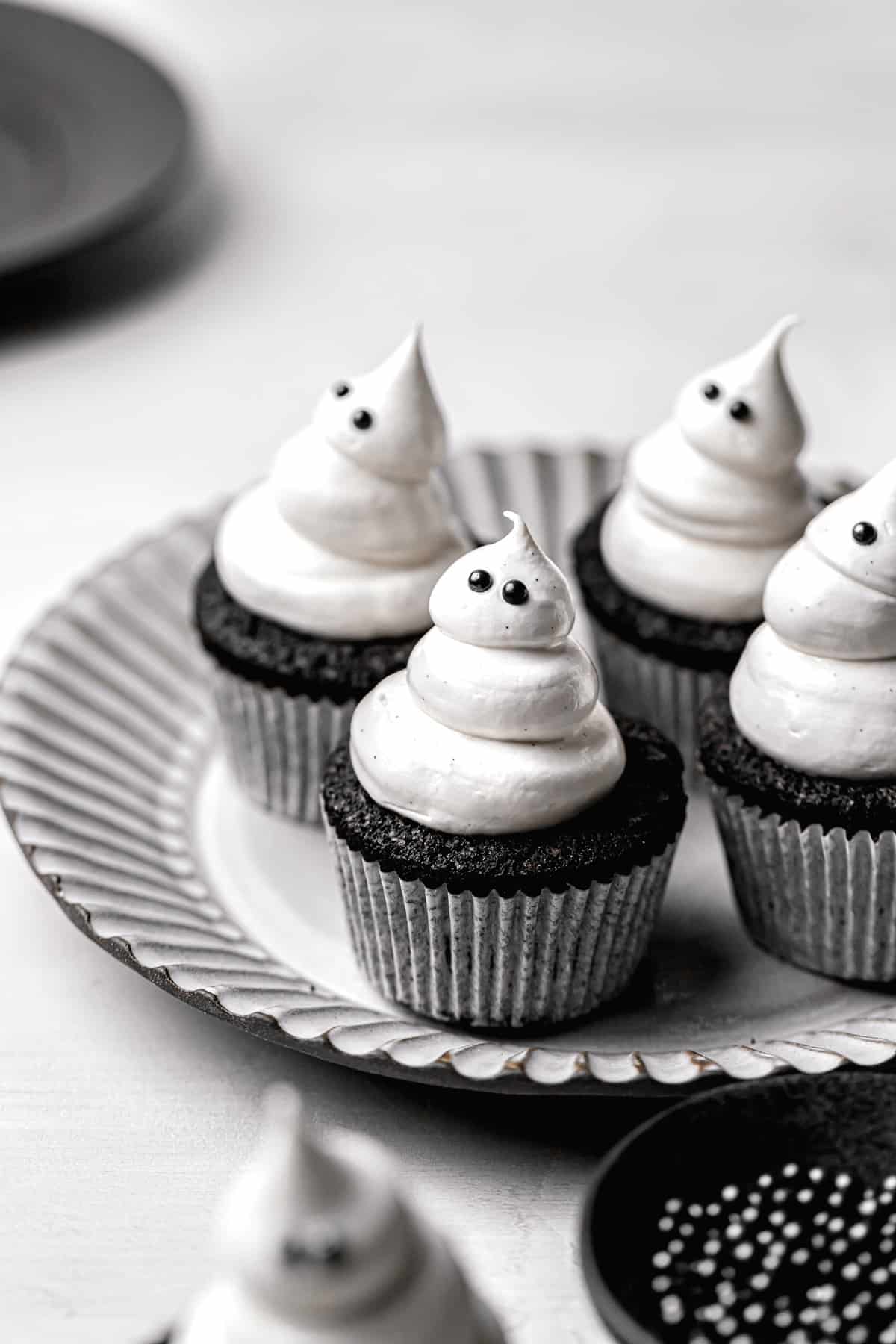 halloween cupcakes on grey plate.
