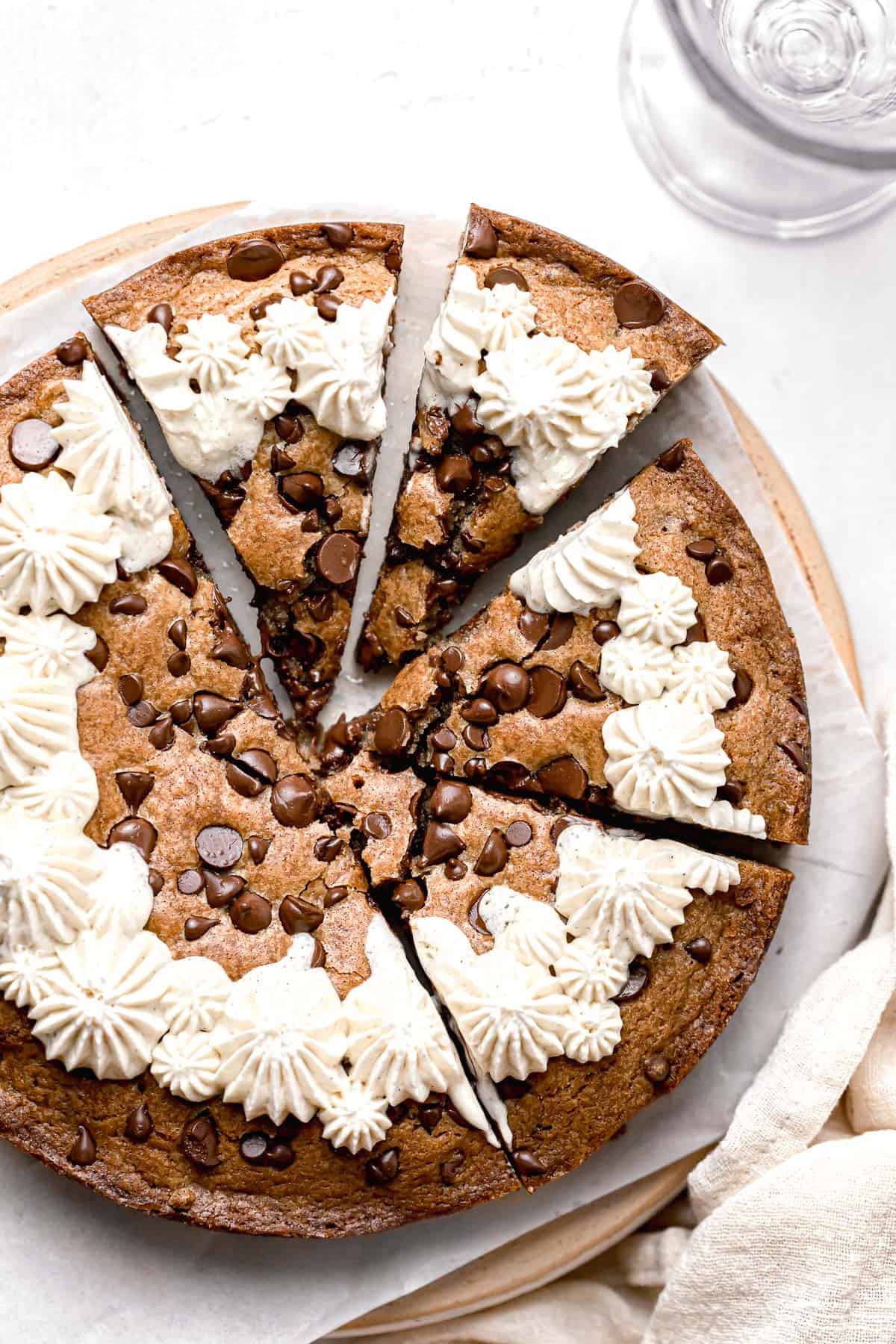 chocolate chip cookie cake with four slices cut