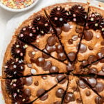 chocolate chip cookie cake cut into individual slices.