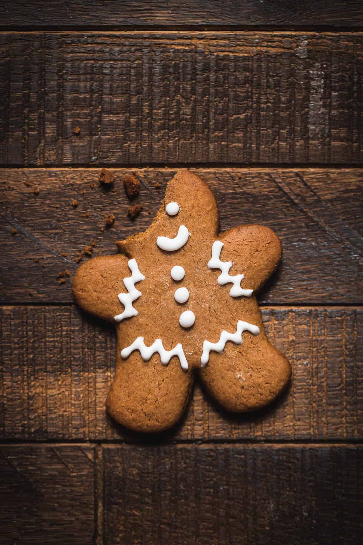 one gingerbread men cookie with bite taken out.