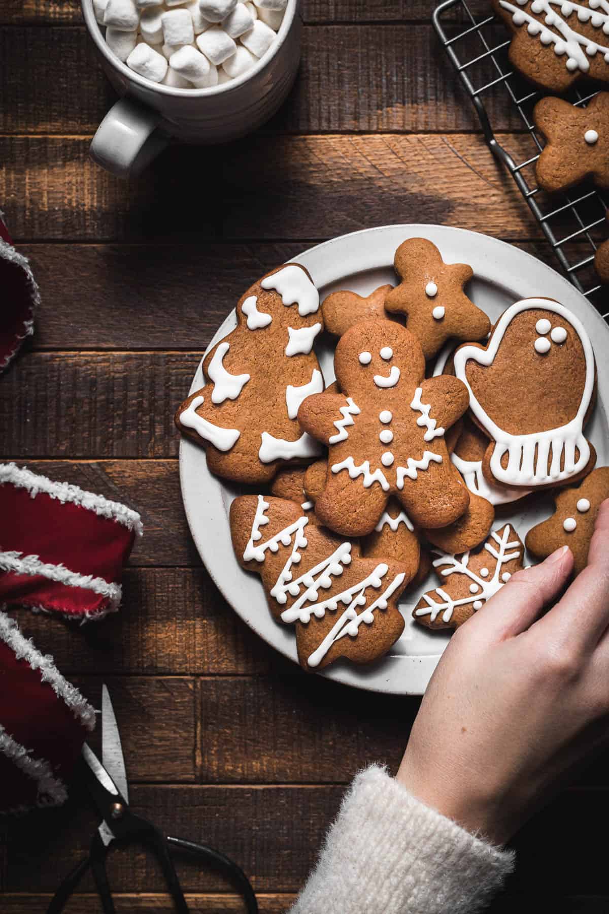decorated gingerbread cookies on white plate
