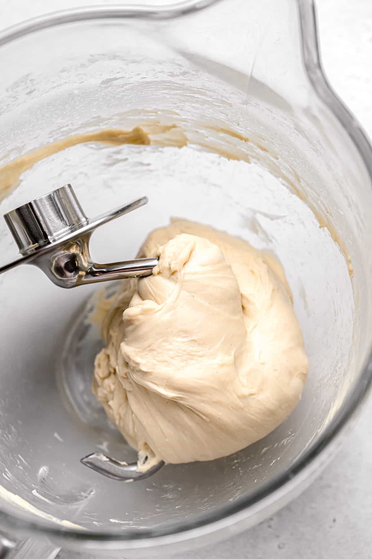 milk bread dough in glass mixing bowl.