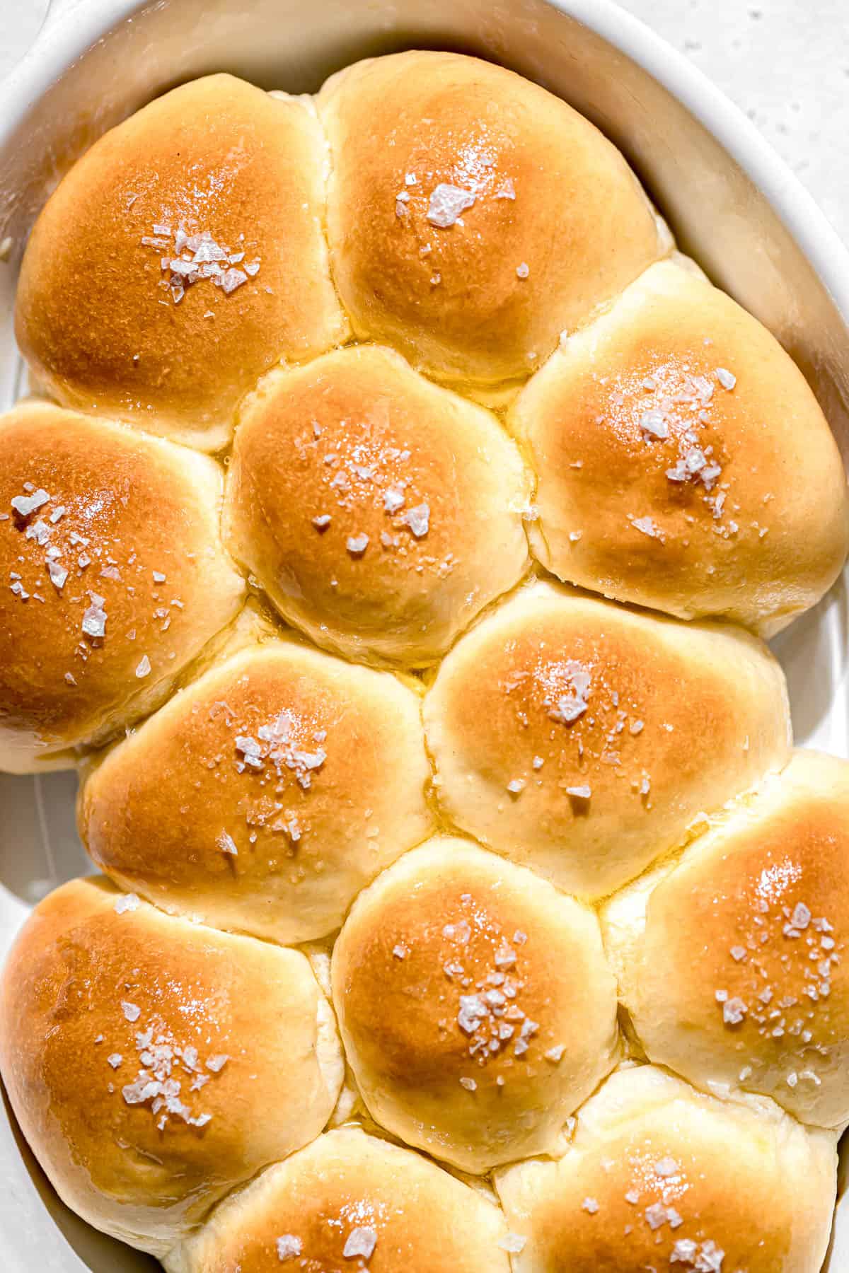 milk bread rolls in white dish.