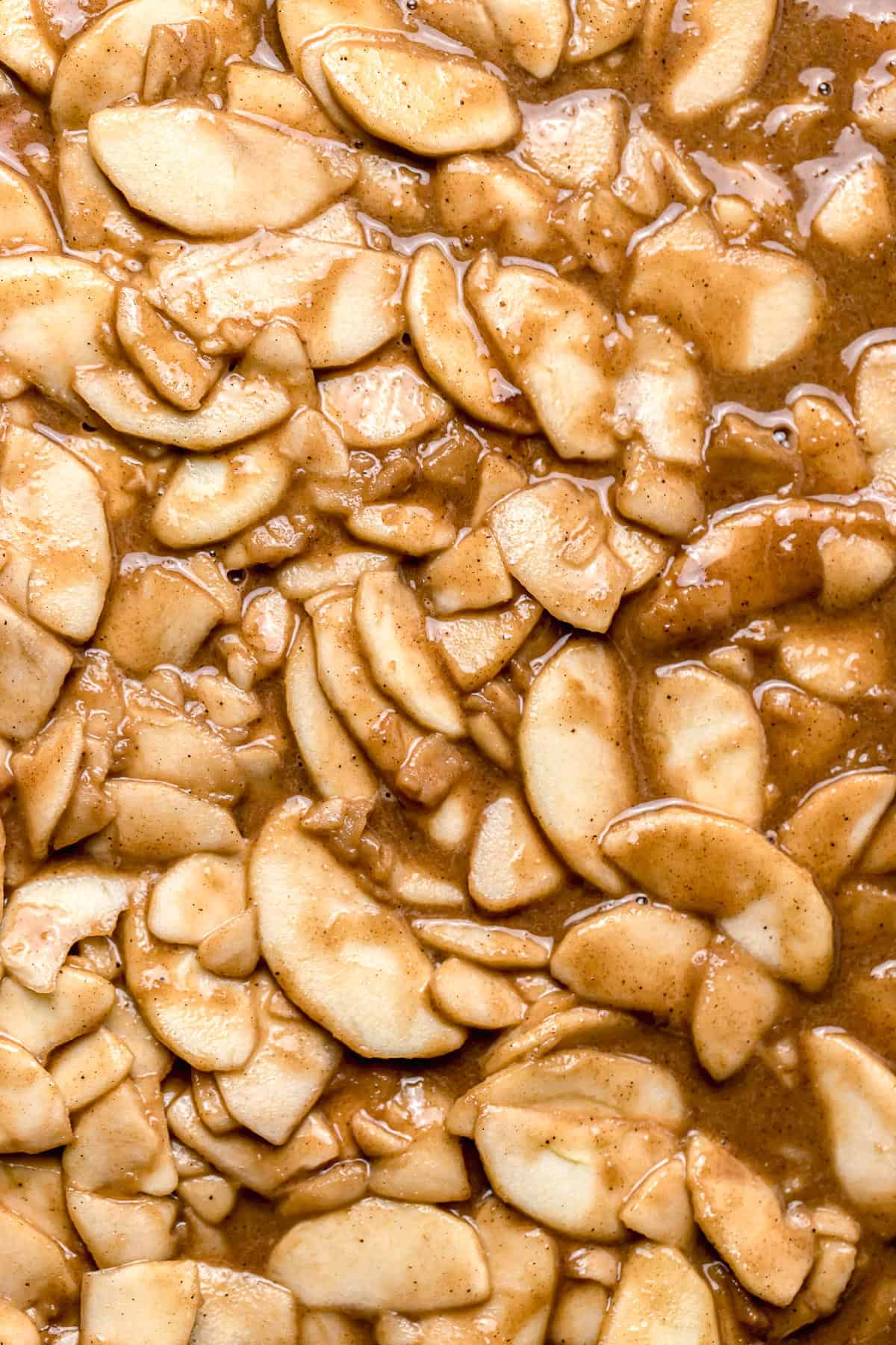 close-up of caramel apple pie filling spread out on baking sheet.