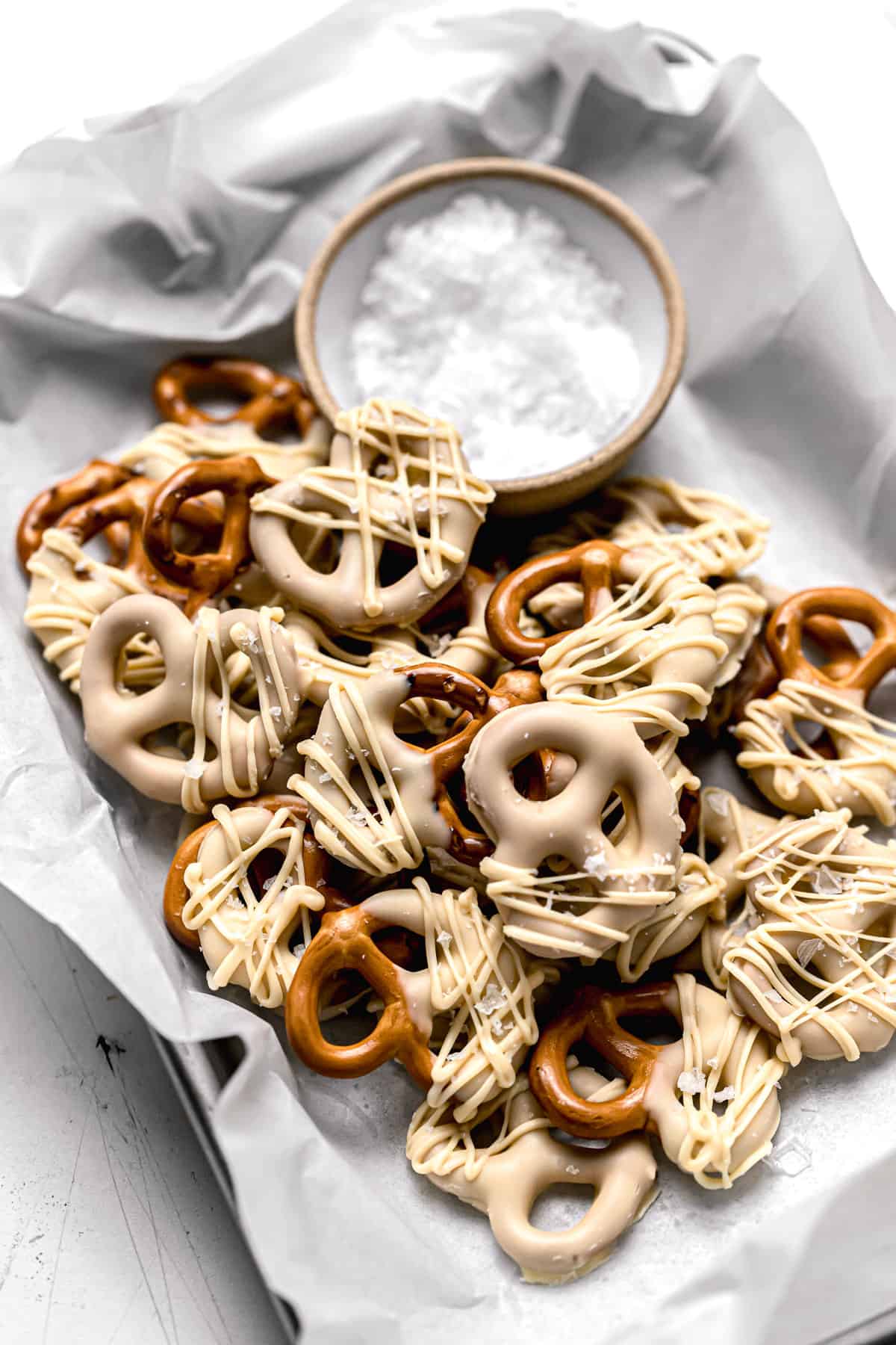 white chocolate covered pretzels in small tray.