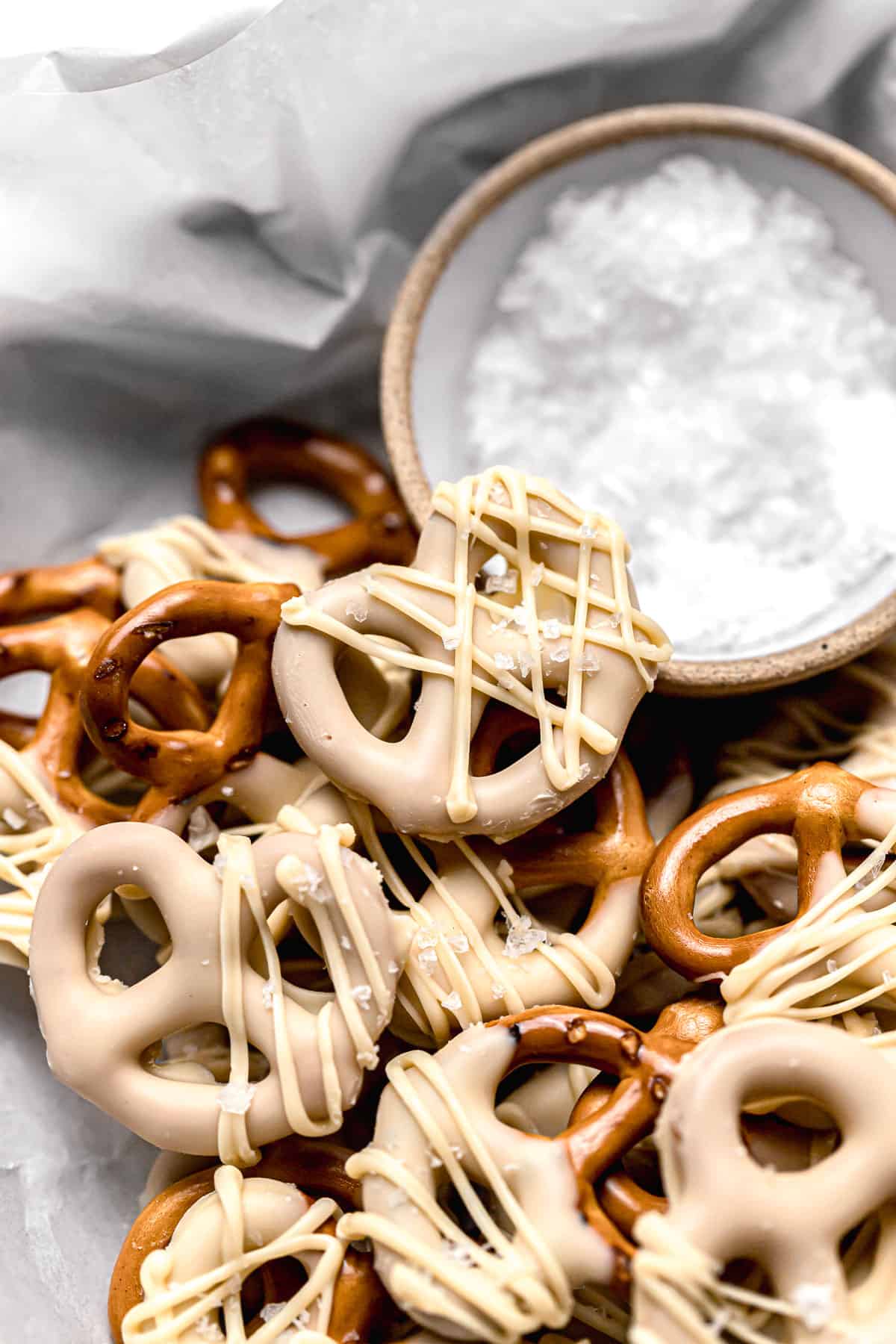 close-up of caramelized white chocolate covered pretzels in a pile.
