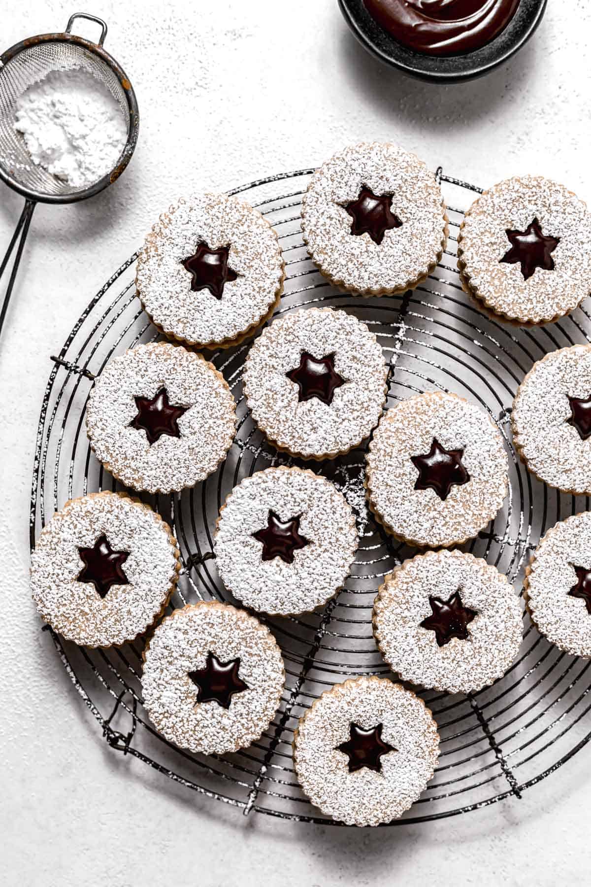 assembled linzer cookies on wire rack.