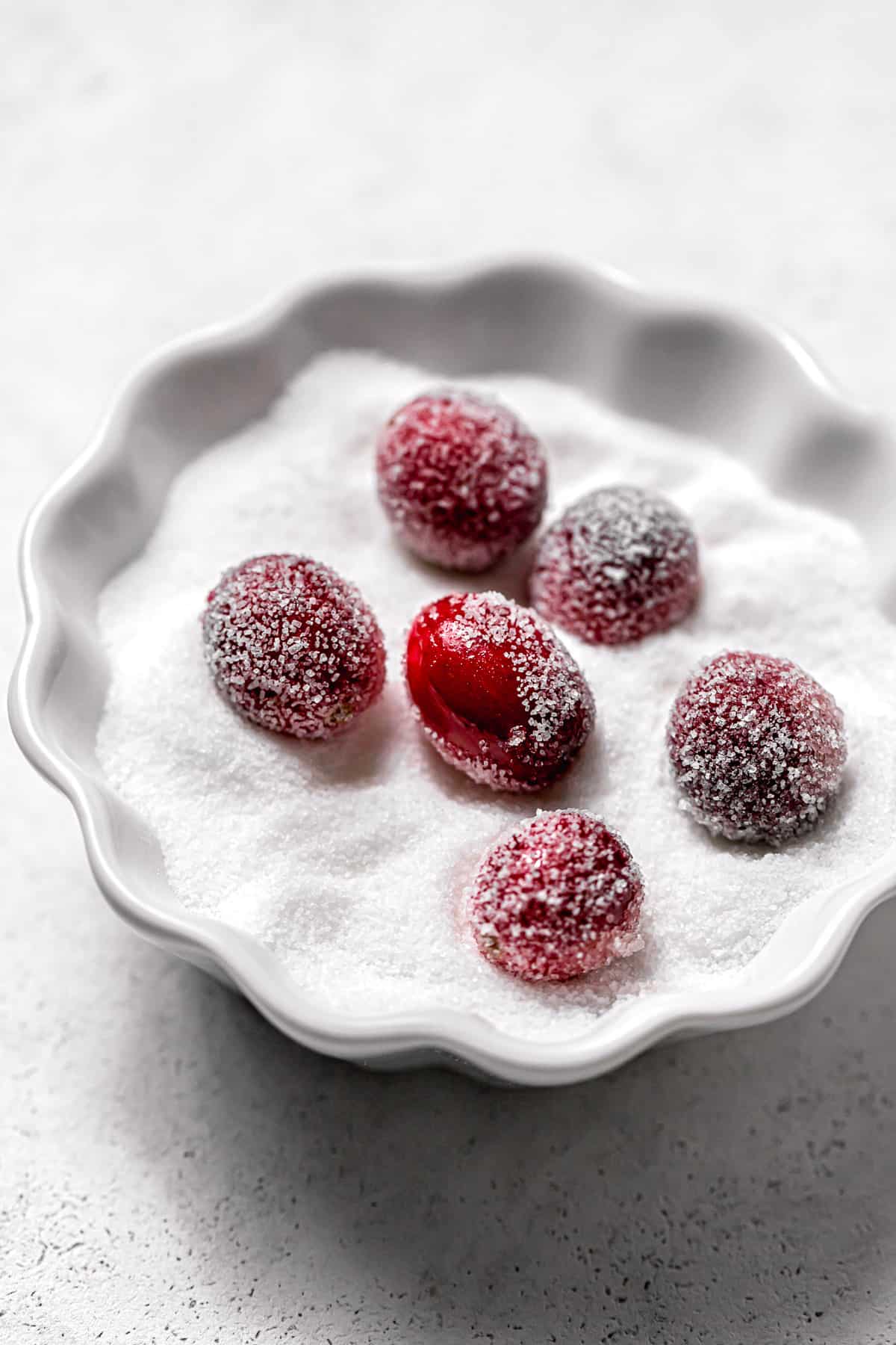 cranberries in bowl of sugar.