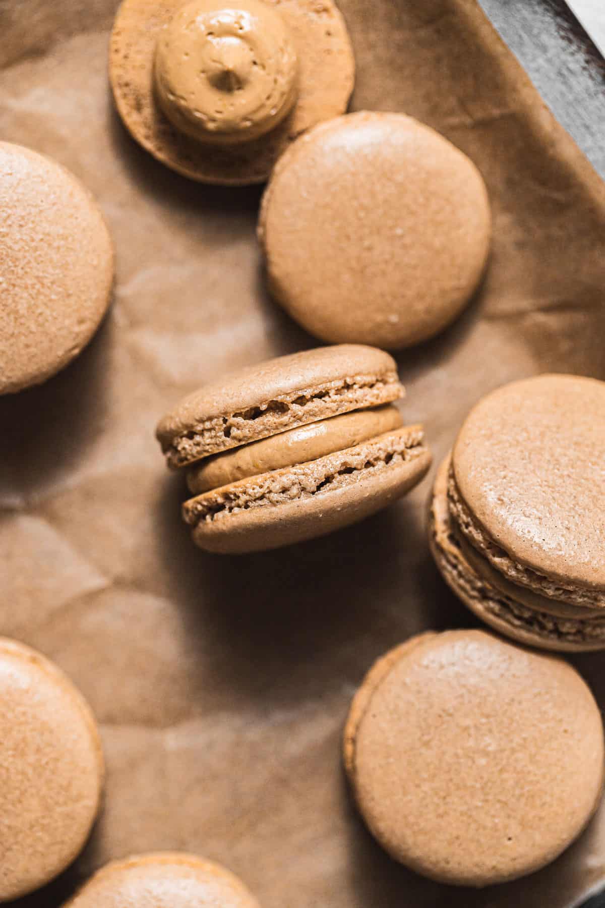 coffee macarons on parchment paper