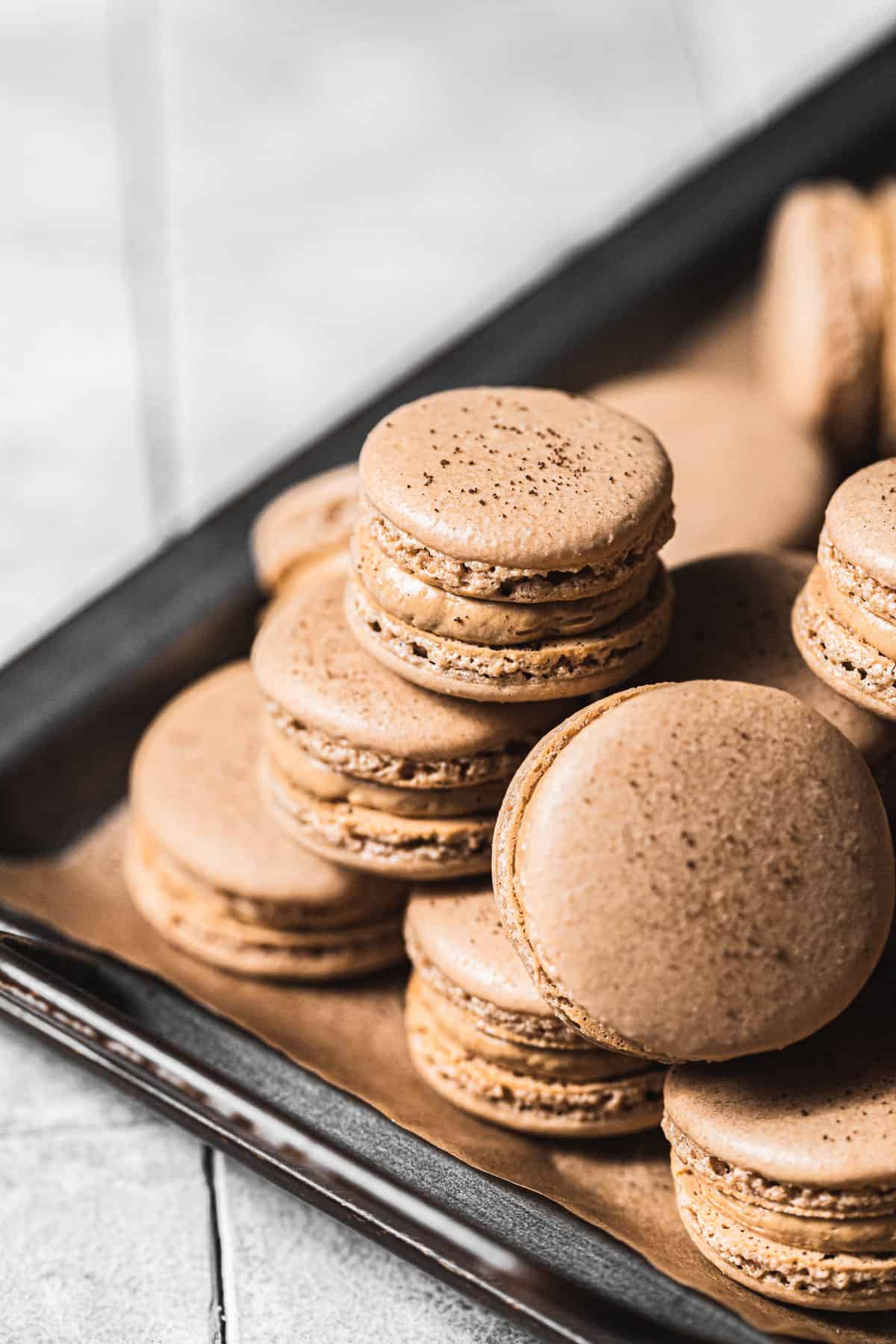coffee macarons stacked.
