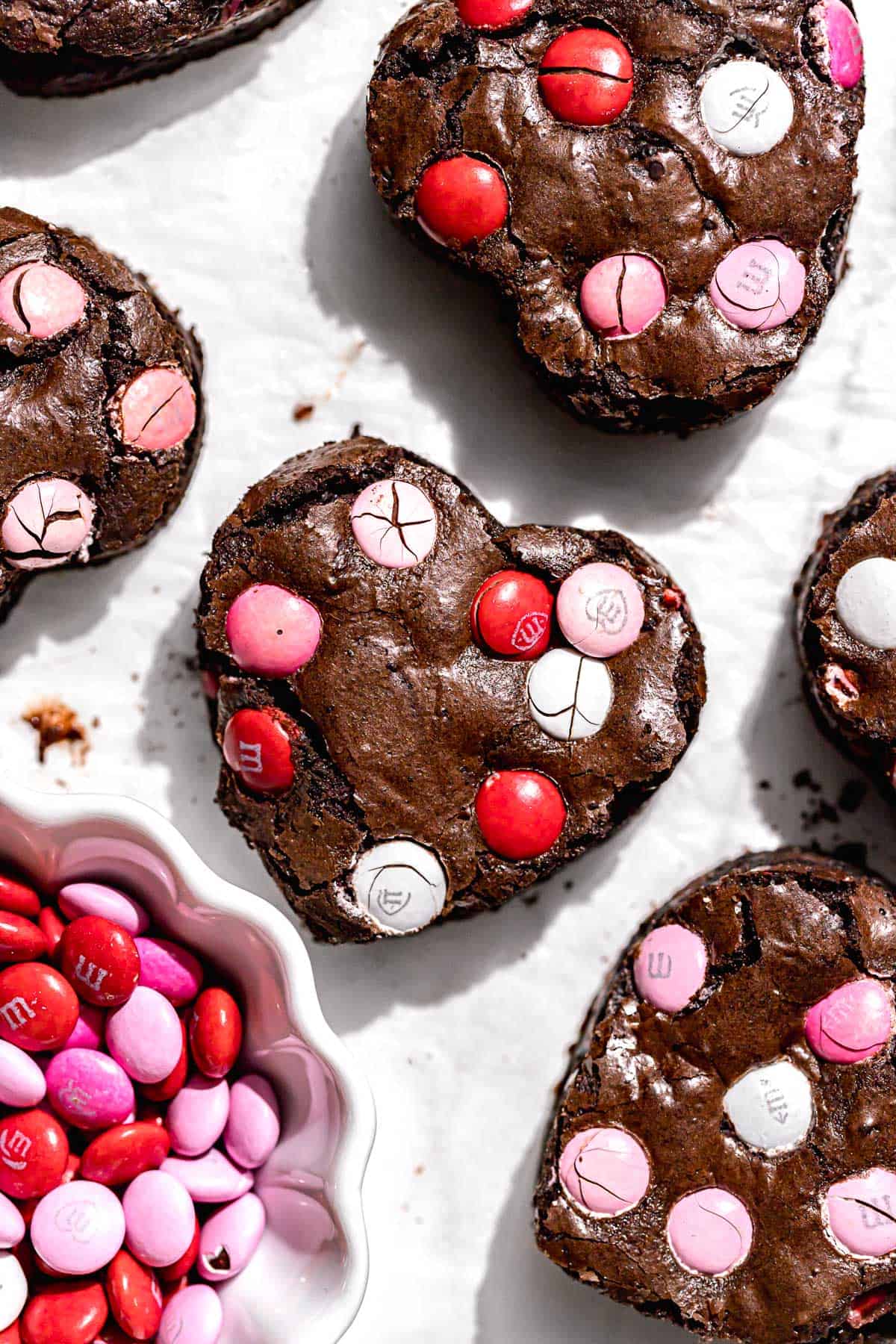heart shaped valentine m&m brownies on parchment paper