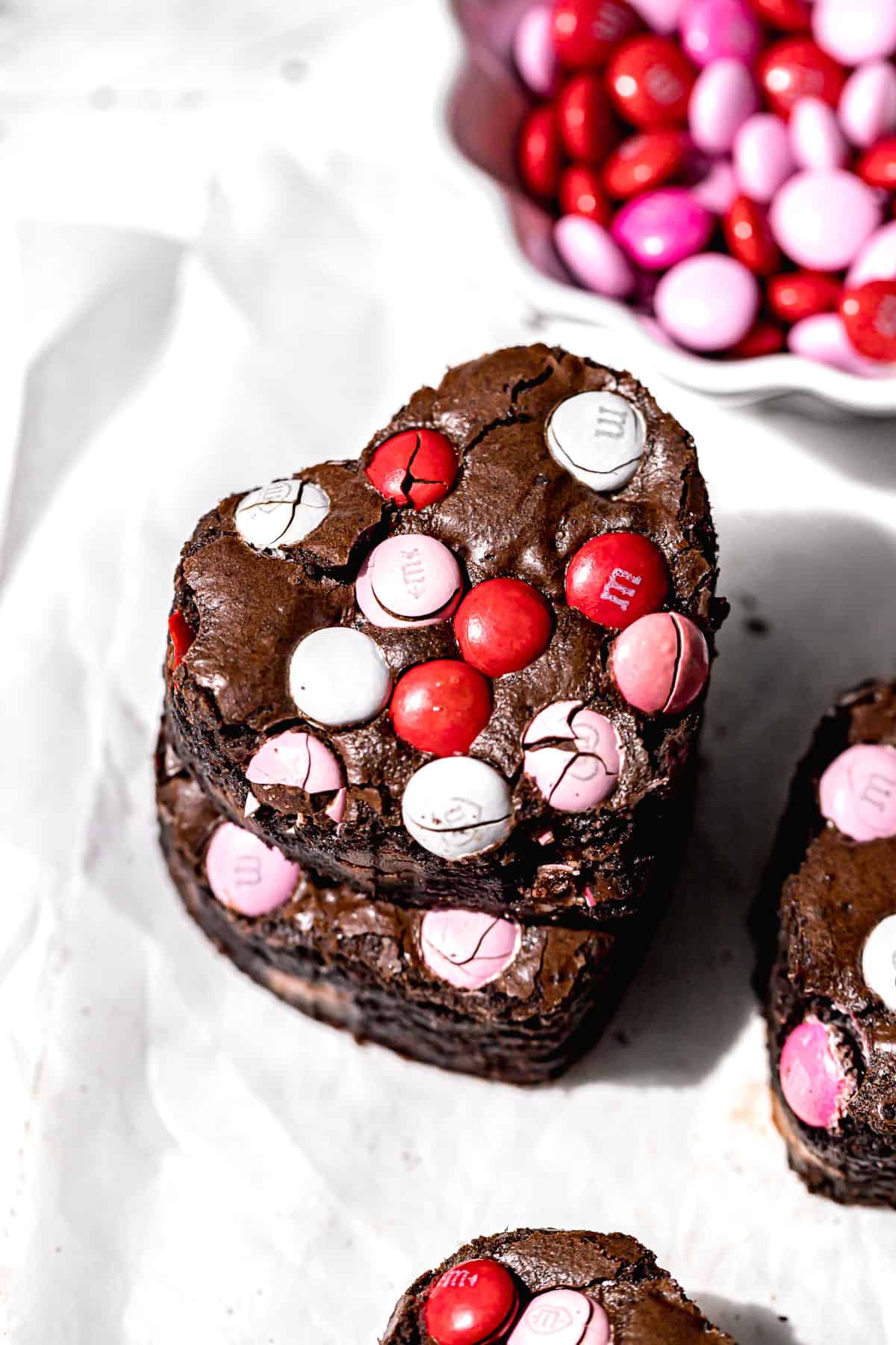 two heart shaped M&M brownies stacked.