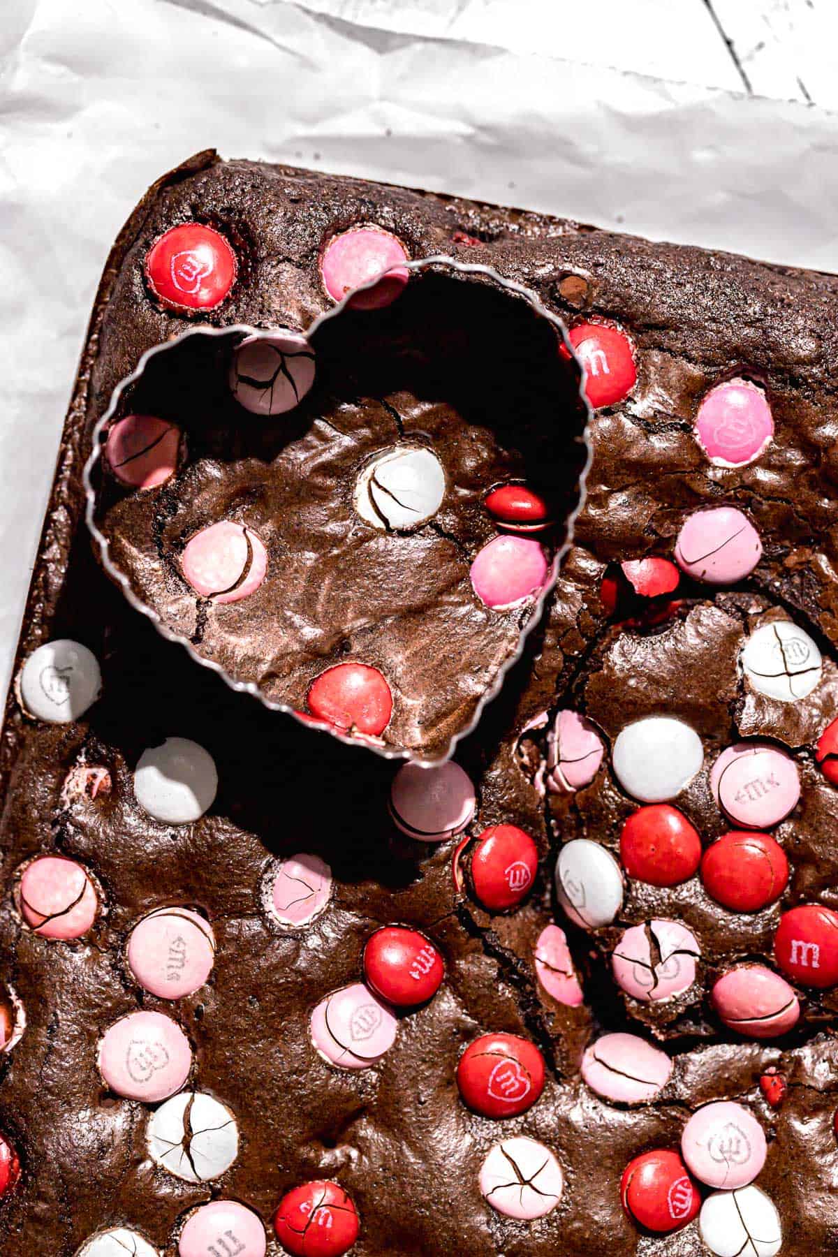 heart cookie cutter on top of baked brownies.