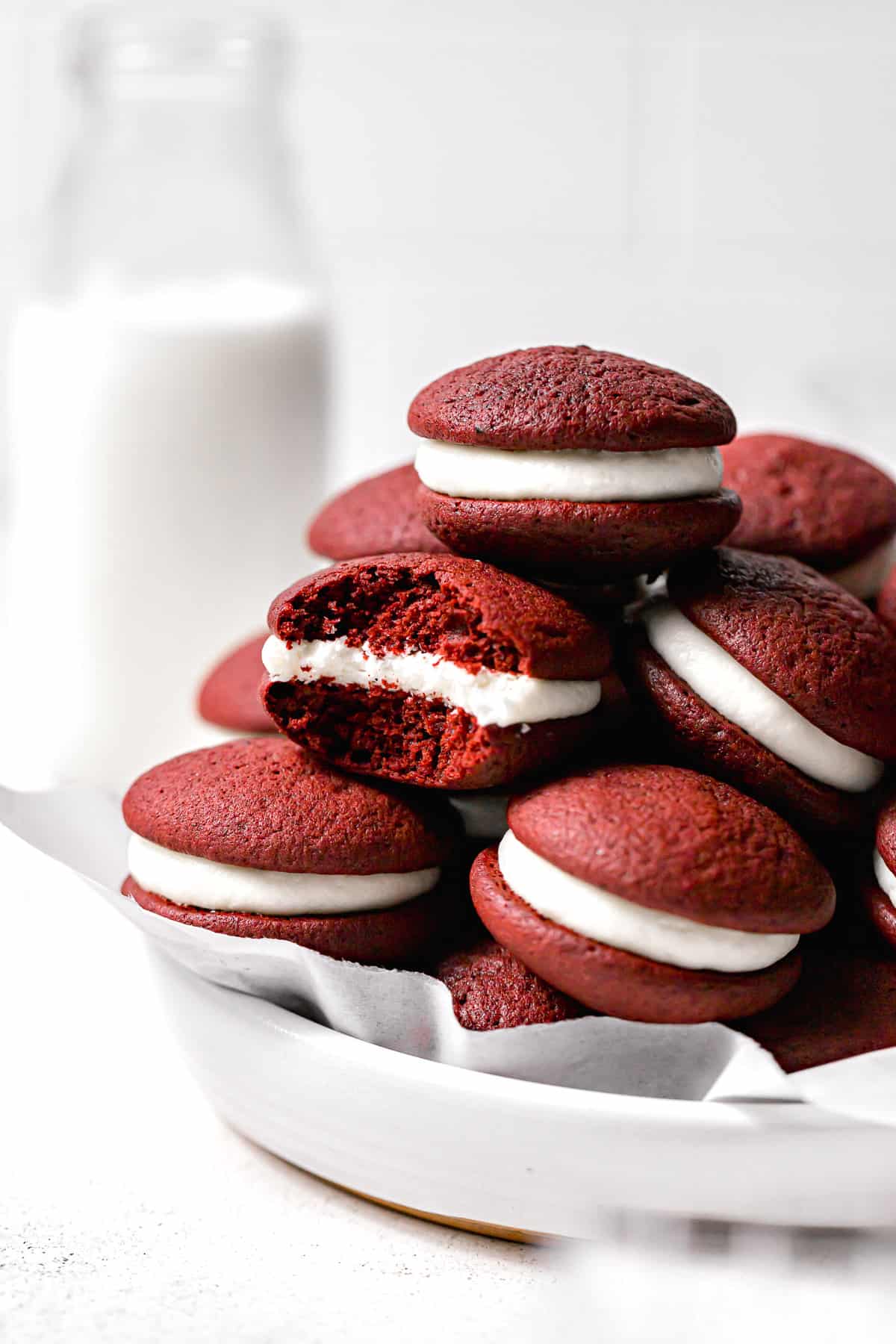mini whoopie pies in a pile with bite taken out of one.